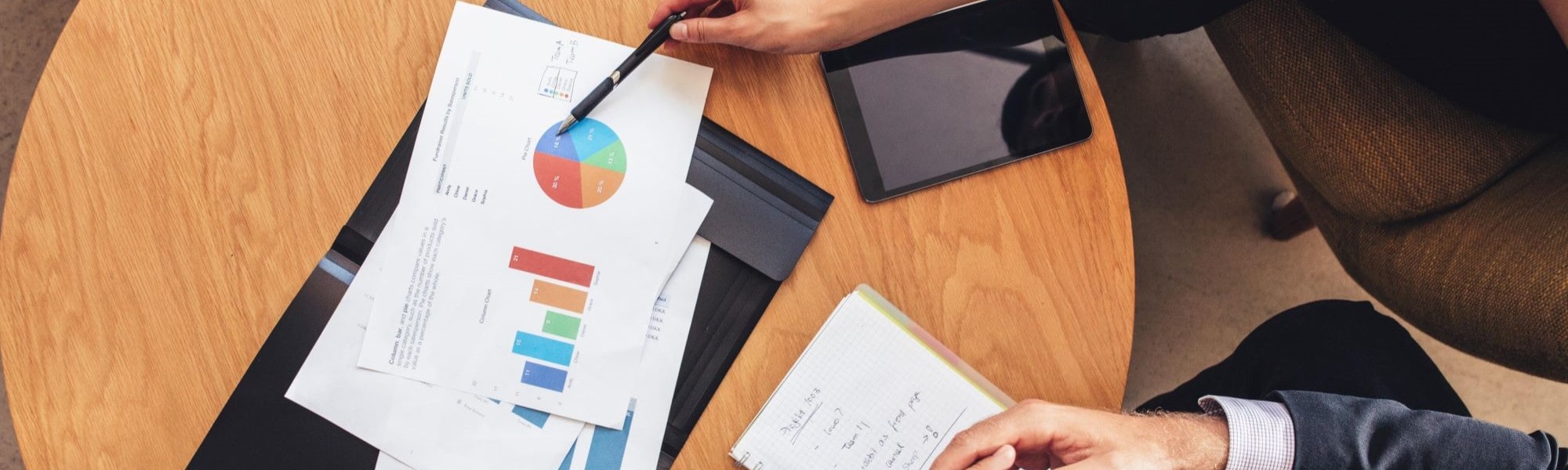 Graphs and paperwork on table